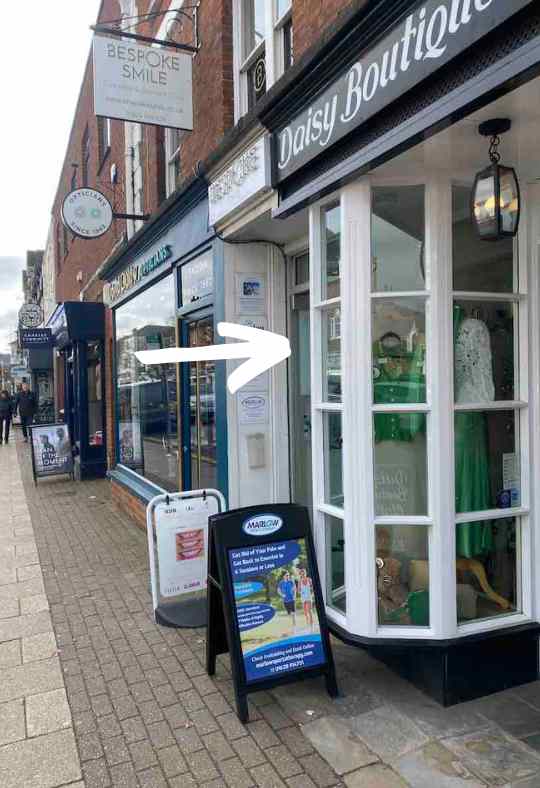 42 High Street Clinic Entrance, in between Daisy Boutique and David Clulow Optician Entrance